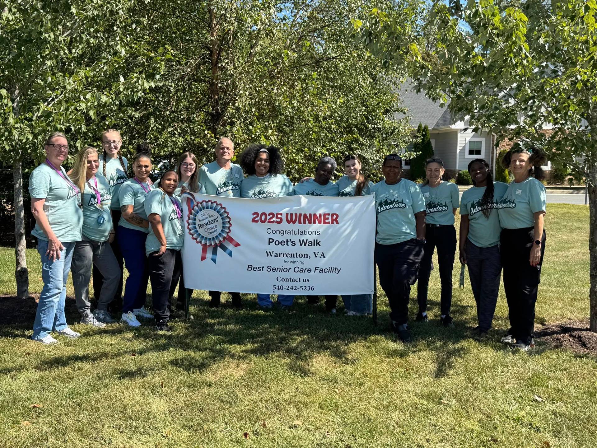 Employees of Poet's Walk standing with their award.